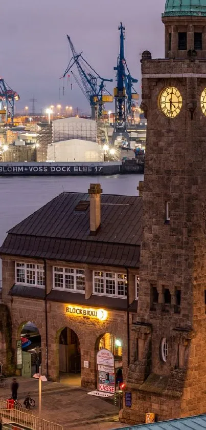 Scenic clock tower by the harbor at evening with industrial background.