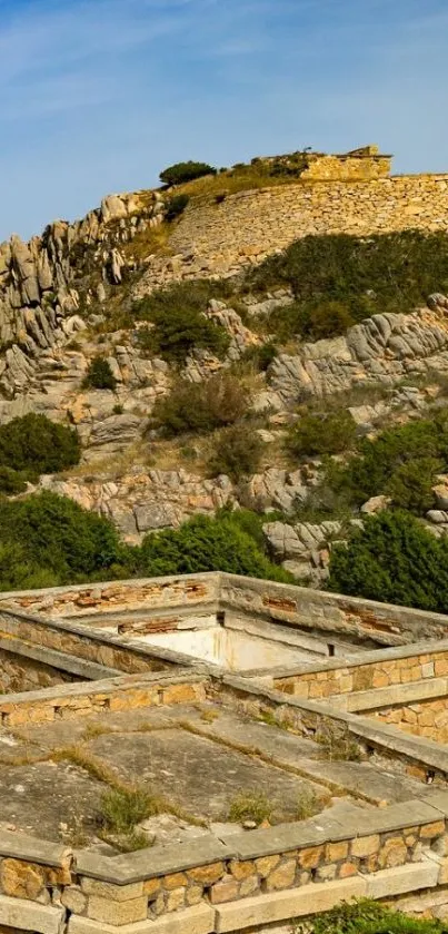 Stone structure on a scenic hilltop with natural landscape.