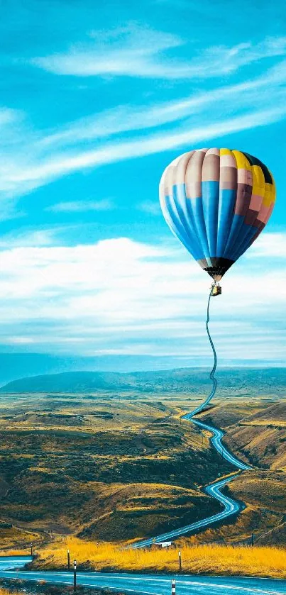 Colorful hot air balloon flying over a scenic landscape under a vibrant blue sky.