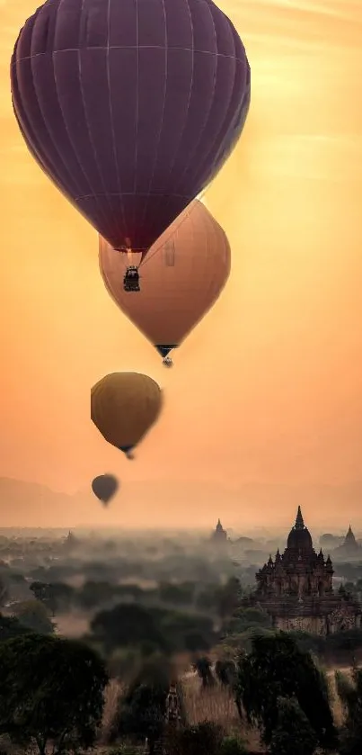 Hot air balloons at sunset over ancient temples.