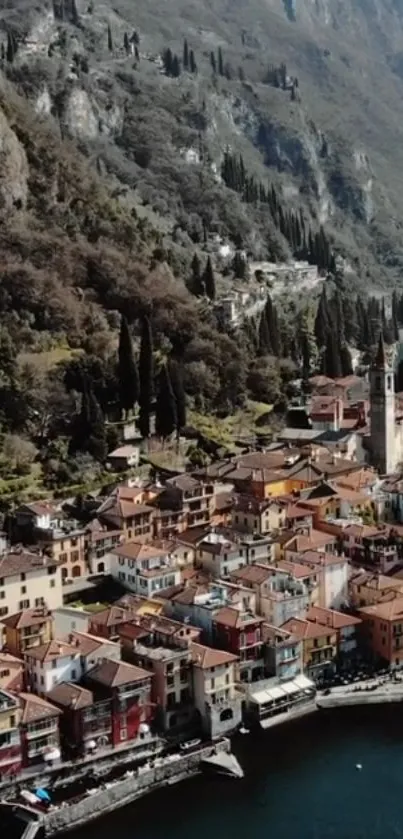 Aerial view of Italian lakeside village with colorful houses and mountains.