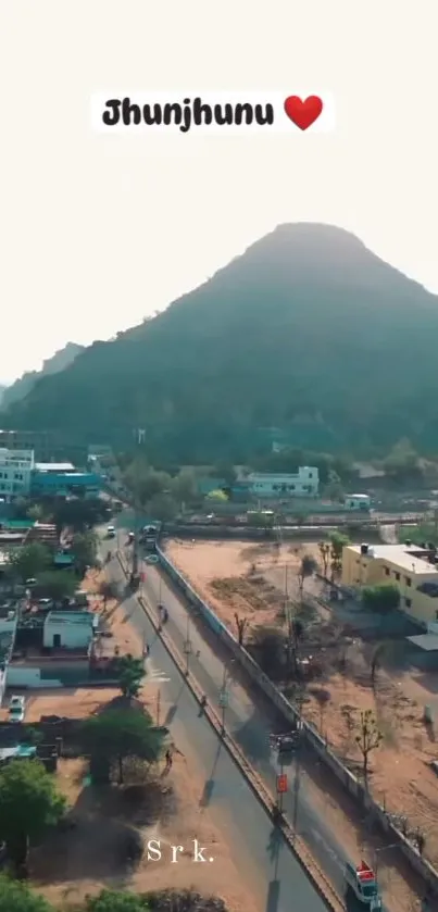 Aerial view of Jhunjhunu city with mountains in the background.