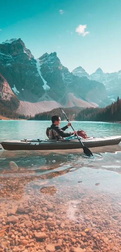 Kayaker paddling in a serene, turquoise mountain lake with scenic views.