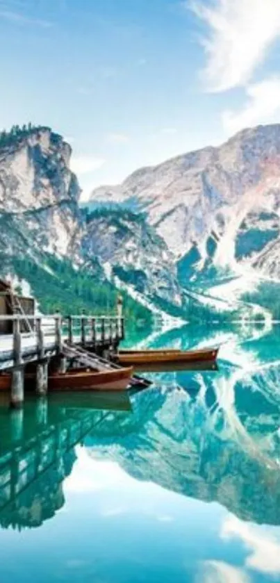 Calm lake with mountain backdrop and reflections.