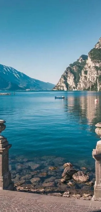 Scenic lake and mountain view with clear sky wallpaper.