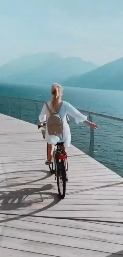 Cyclist riding on a lakeside boardwalk.