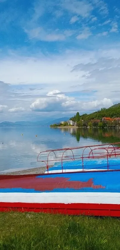 Lakeside view with colorful boats and a clear blue sky.