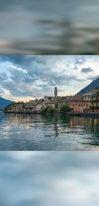 Scenic view of lakeside town with mountains and blue sky.