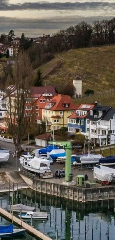 Scenic view of lakeside village with colorful houses and moored boats.