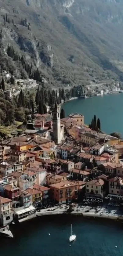 Scenic aerial view of lakeside village with vibrant houses and lush mountains.