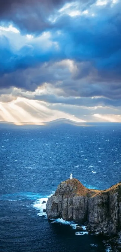 Stunning view of a lighthouse on a coastal cliff with an expansive ocean and dramatic sky.