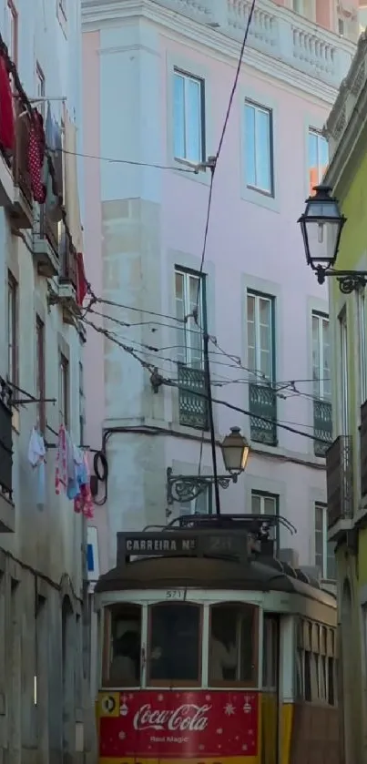 Lisbon tram on narrow street with colorful buildings and clear blue sky.