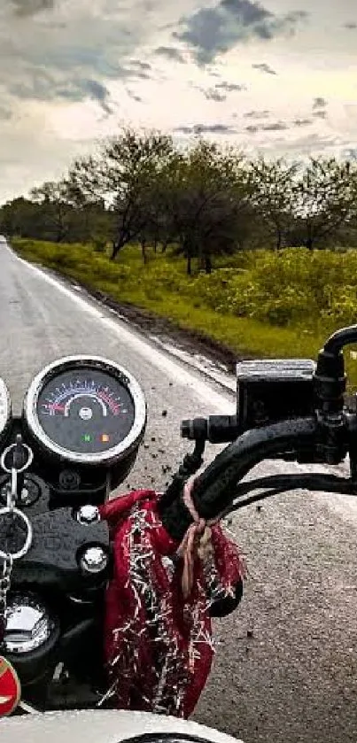 Motorcycle on a scenic road with trees.