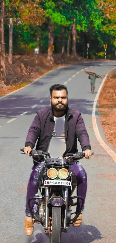 Man riding motorcycle on scenic forest road.