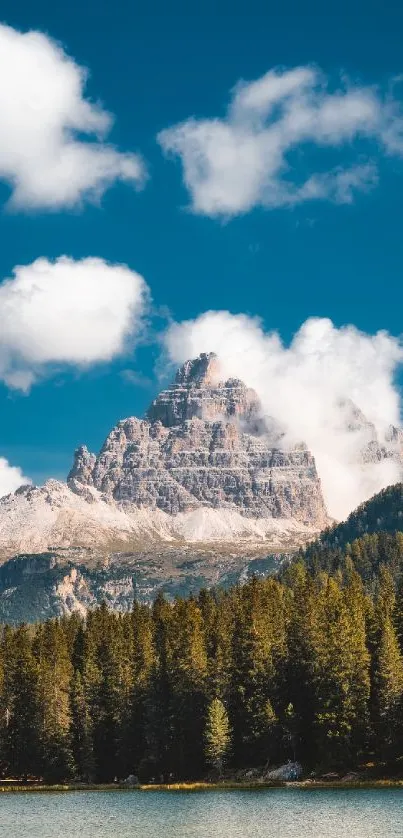 Majestic mountain with forest and blue sky on mobile wallpaper.