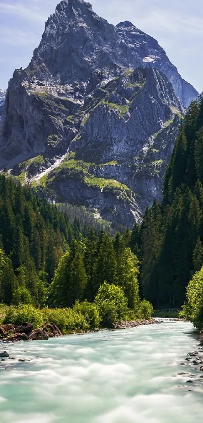 Mountain and river landscape with lush green trees.