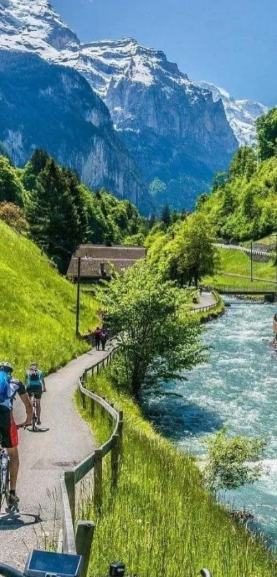 Mountain biking path with river and snow-capped mountains in a scenic landscape.