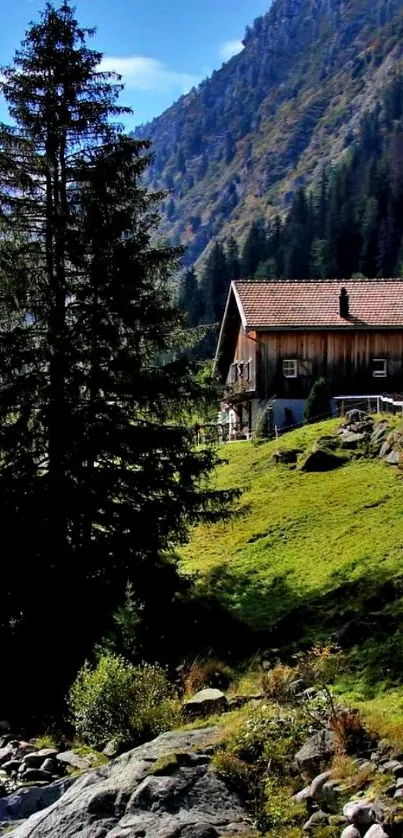 Mobile wallpaper of a serene mountain cabin with green landscape.