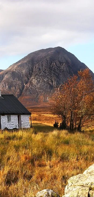 Mountain landscape with cottage and autumn hues.