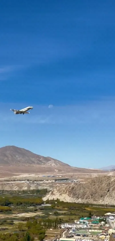 Airplane flying over mountains with clear blue sky.