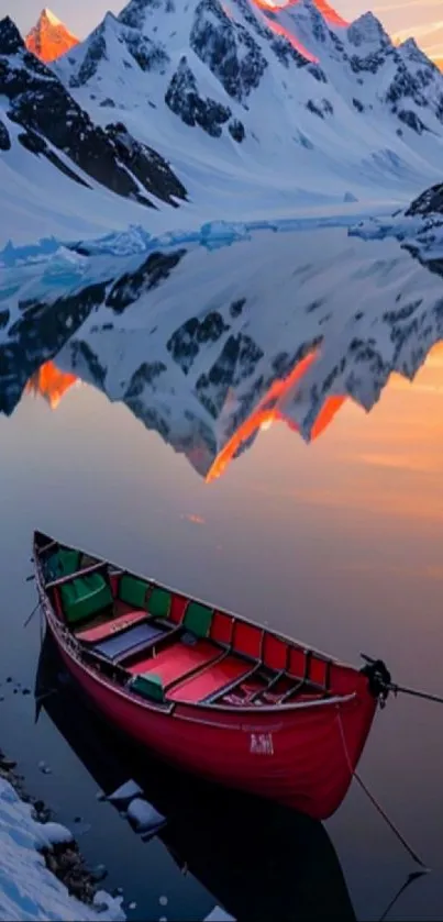 Scenic sunset over mountain lake with red boat and snow peaks.