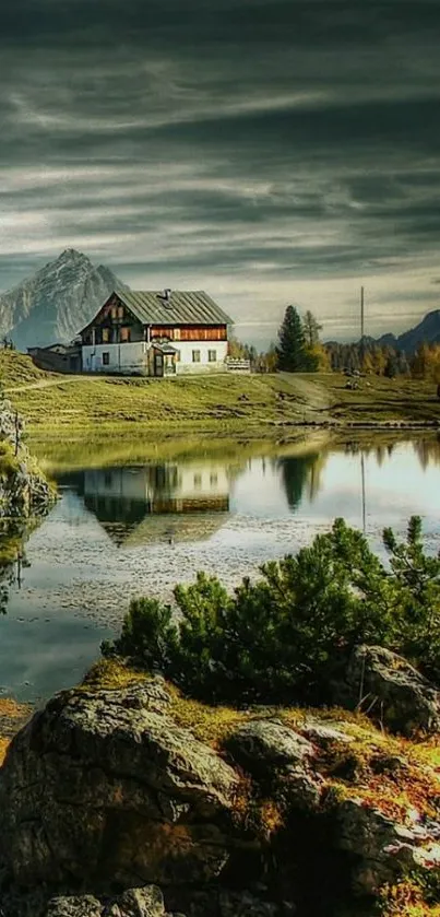 Tranquil mountain lake with cabin and scenic views.