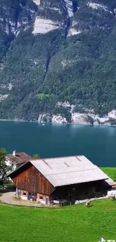 Scenic view of mountain lake with cabin and lush greenery.