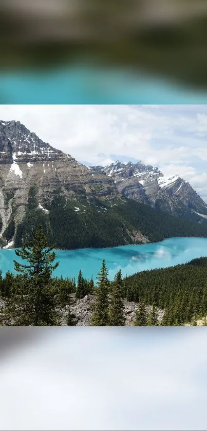 Mobile wallpaper of a turquoise lake in a mountain landscape.