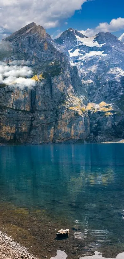 A serene mountain lake with blue sky and majestic peaks for mobile wallpaper.