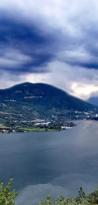 Breathtaking view of a mountain lake under a dramatic cloudy sky.