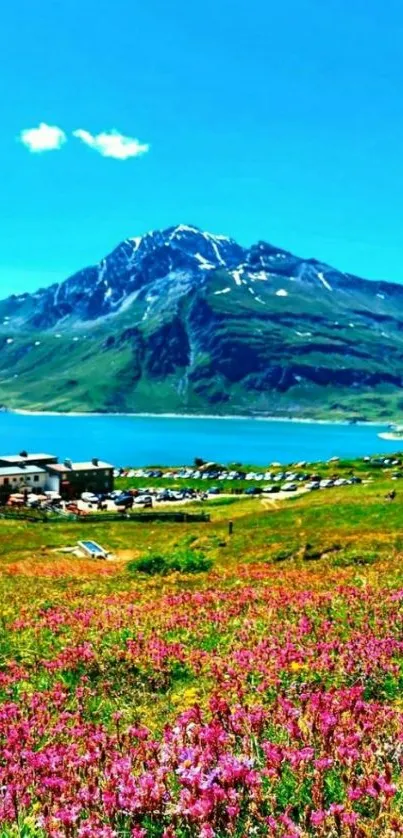 Scenic mountain lake with vibrant flowers and clear blue sky.