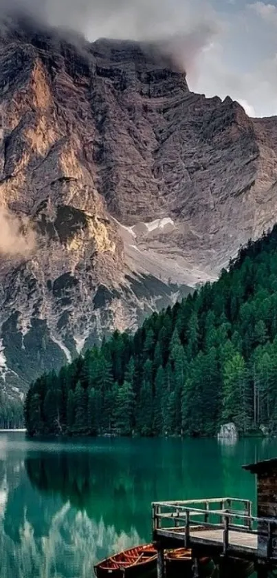 Stunning emerald green lake with mountains and forest.