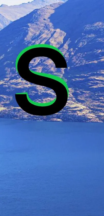 Letter 'S' over a scenic mountain lake view wallpaper.