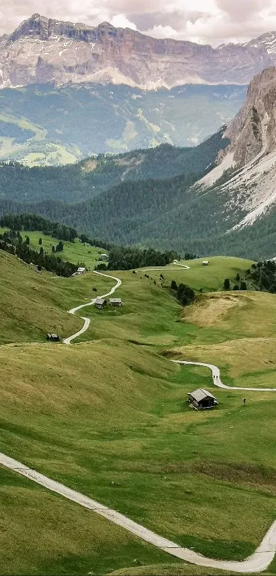 Scenic mountain landscape with winding paths and lush green valleys.