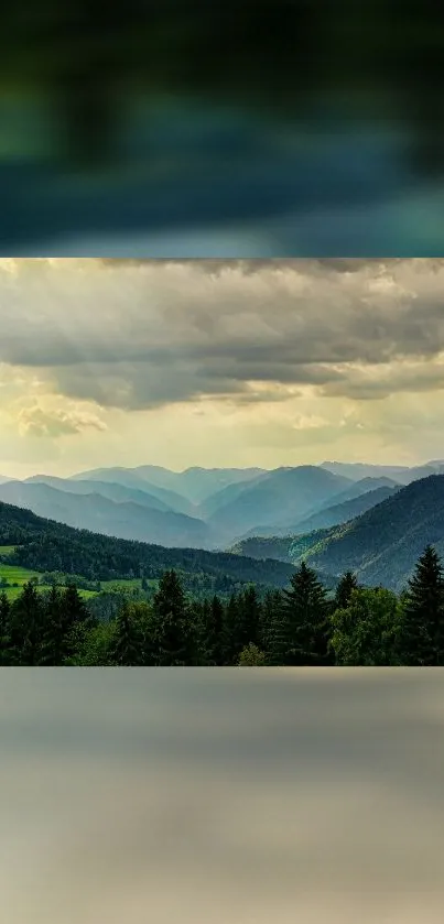 Breathtaking mountain view with green valleys under a cloudy sky.