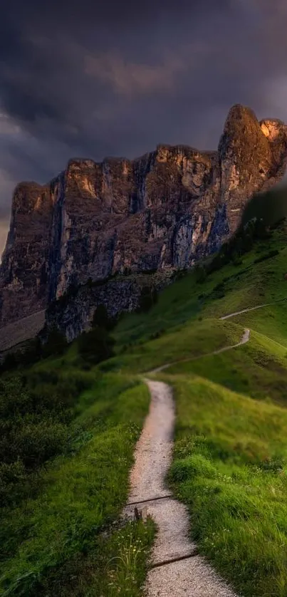 Serene mountain path with lush greenery and towering cliffs.