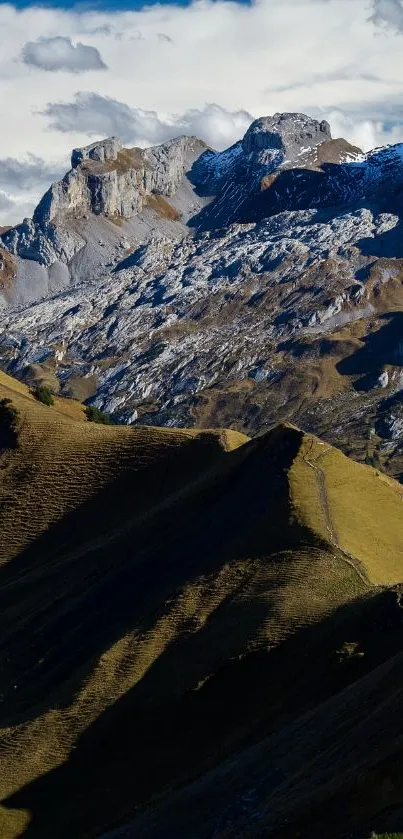 Scenic mountain range under dramatic sky.