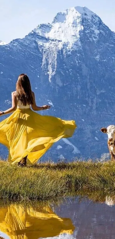 Woman in yellow dress by mountain with reflection