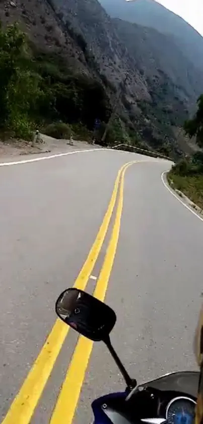 Motorcycle on a winding mountain road, capturing a scenic adventure view.