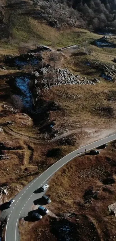 A winding road through a rocky mountainous landscape.