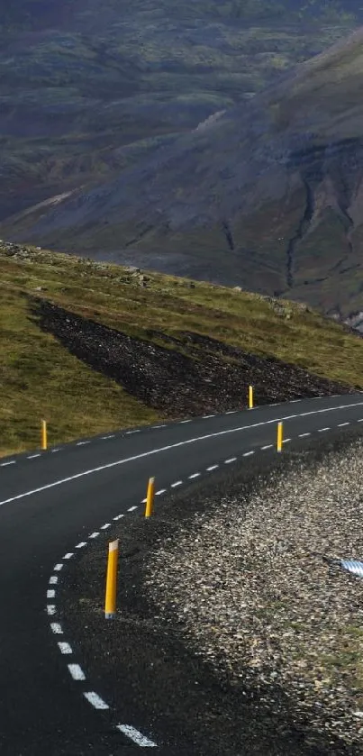 Scenic mountain road through calming landscapes for mobile wallpaper.