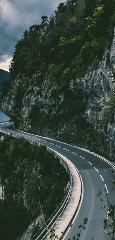 A winding mountain road through lush green cliffs.