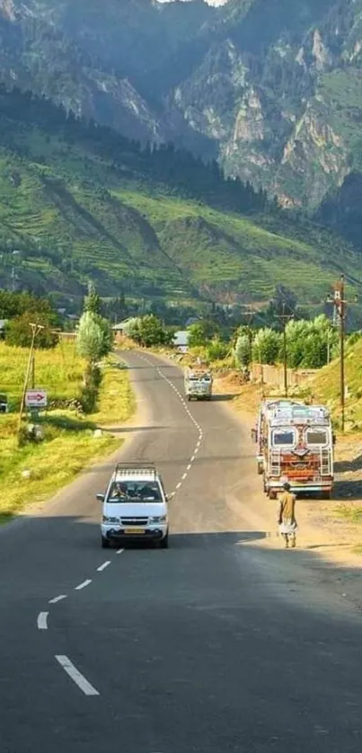 Mobile wallpaper of a scenic mountain road with lush greenery.