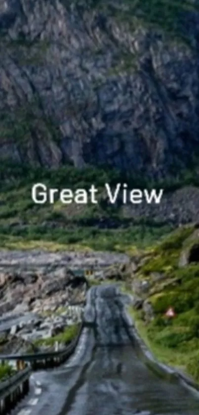 Scenic mountain road with lush green surroundings and rocky landscape.