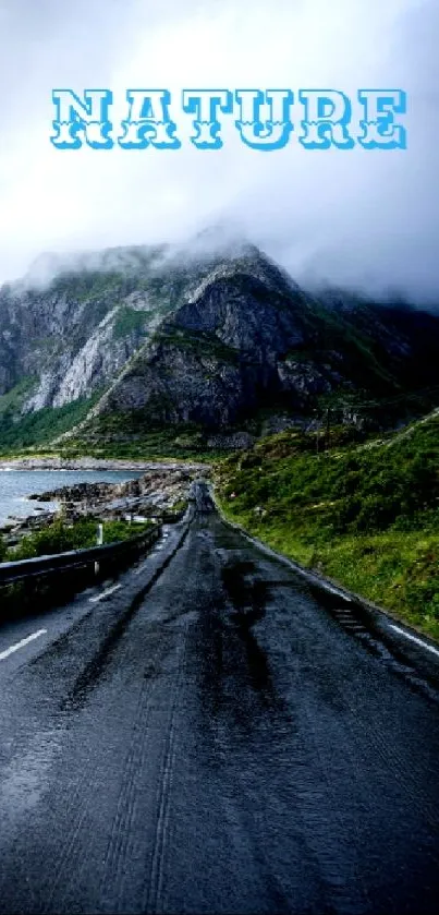 Misty mountain road wallpaper with lush greenery.