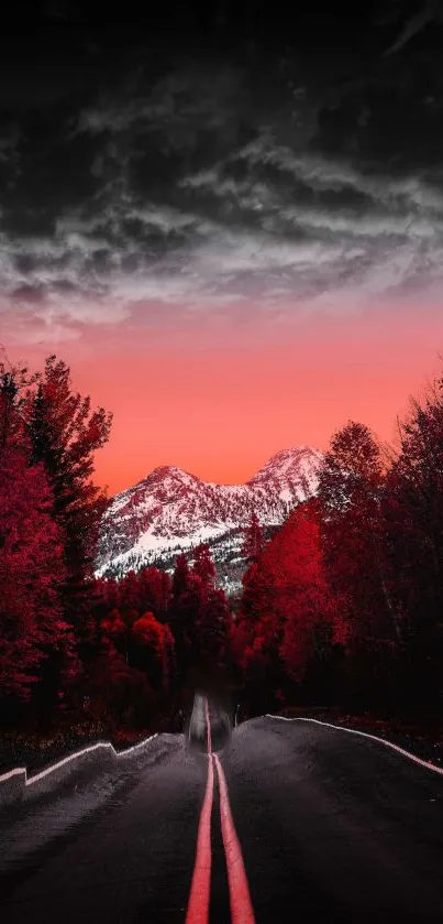 Road leading to mountains under a red sky with trees on the side.