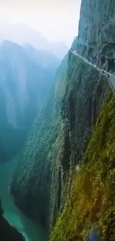 A scenic mountain road winding through lush green cliffs.