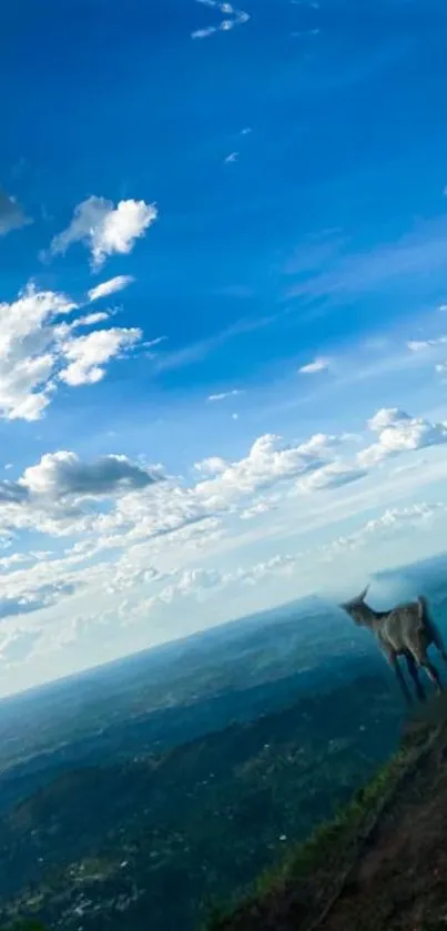 Stunning view of a vibrant sky and mountains with a goat on a cliff.