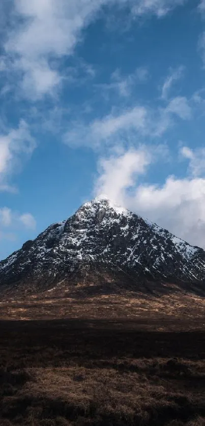 Snow-capped mountain under a vivid blue sky.