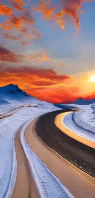 A snowy mountain road under a vibrant sunset sky.